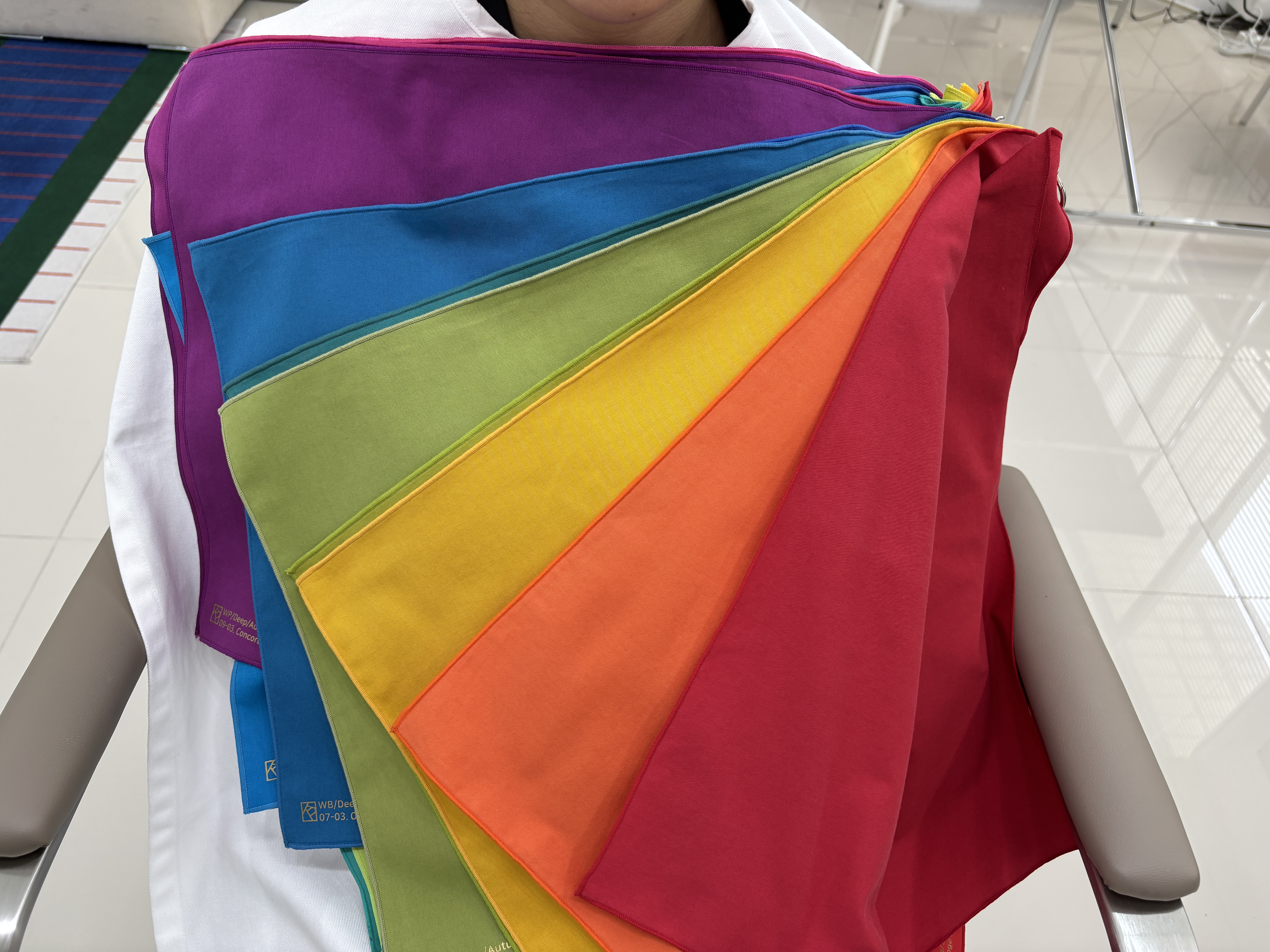 Bright saturated drapes fanned during a colour session