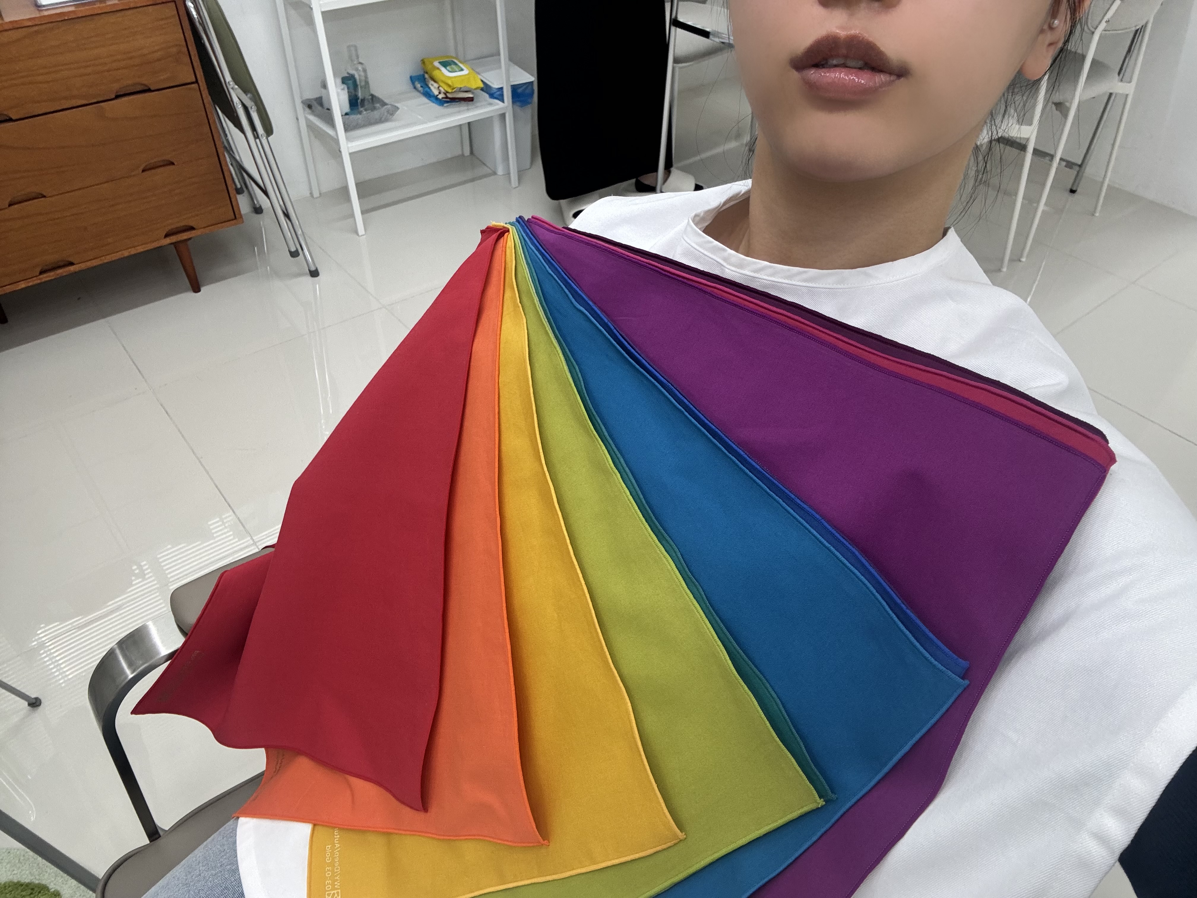 Fanned colour drapes used during a body shape and styling consultation